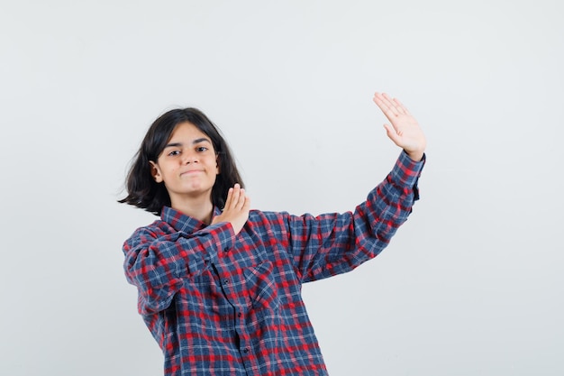 Expressive young girl posing in the studio