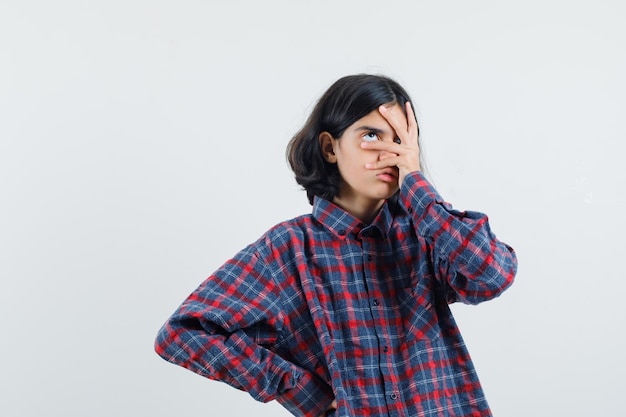 Expressive young girl posing in the studio