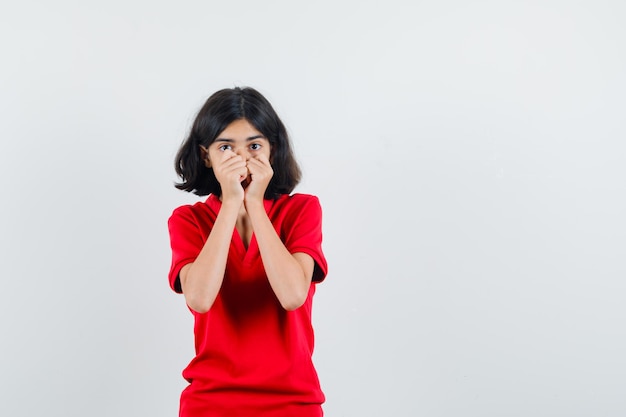 Expressive young girl posing in the studio