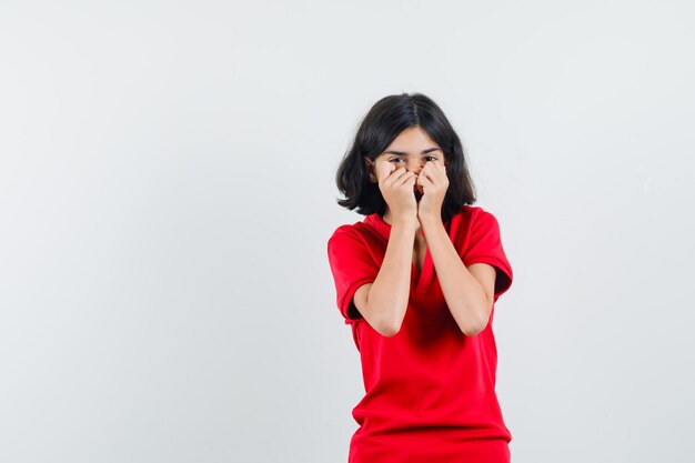 Expressive young girl posing in the studio