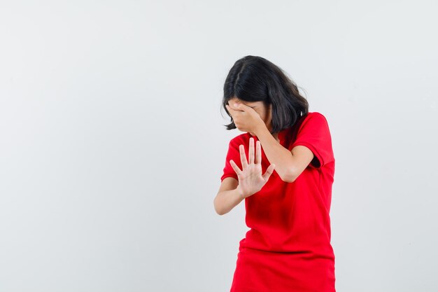 Expressive young girl posing in the studio