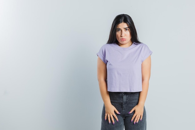 Expressive young girl posing in the studio