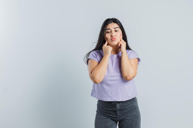 Expressive young girl posing in the studio