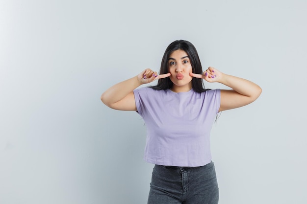 Expressive young girl posing in the studio