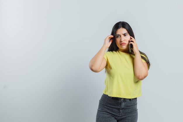 Expressive young girl posing in the studio