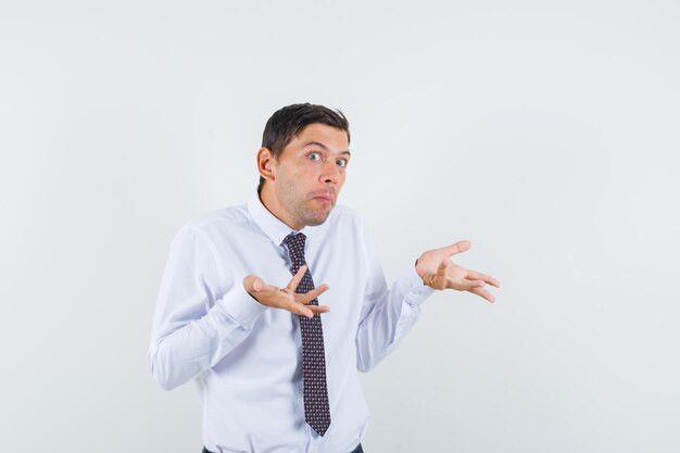 Expressive young guy posing in the studio