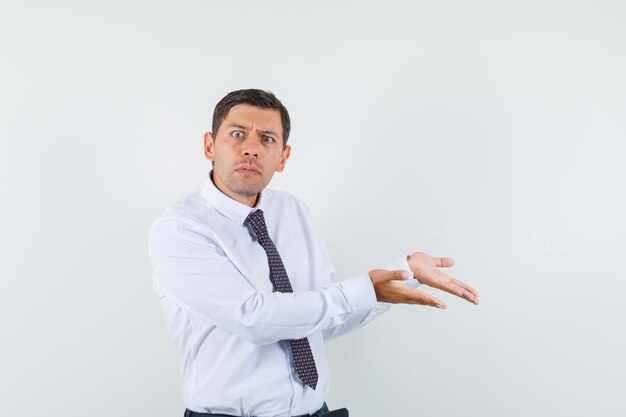 Expressive young guy posing in the studio