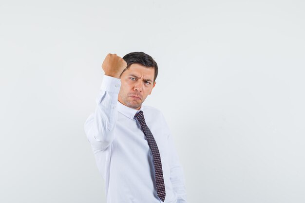 Expressive young guy posing in the studio