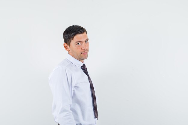 Expressive young guy posing in the studio