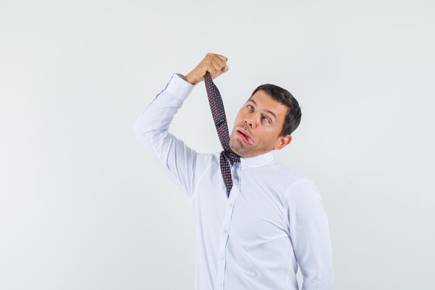 Expressive young guy posing in the studio