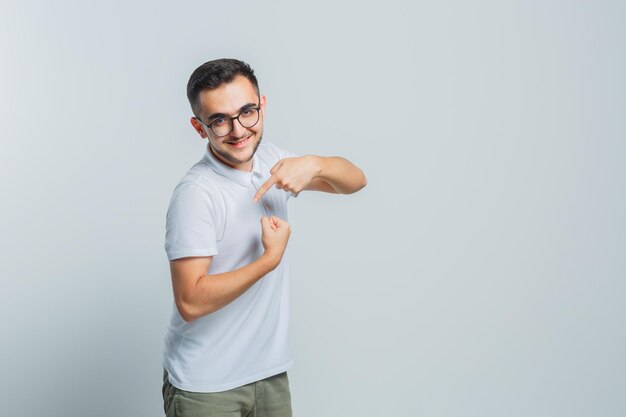 Expressive young guy posing in the studio