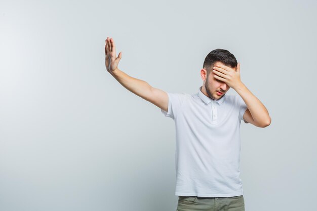 Expressive young guy posing in the studio