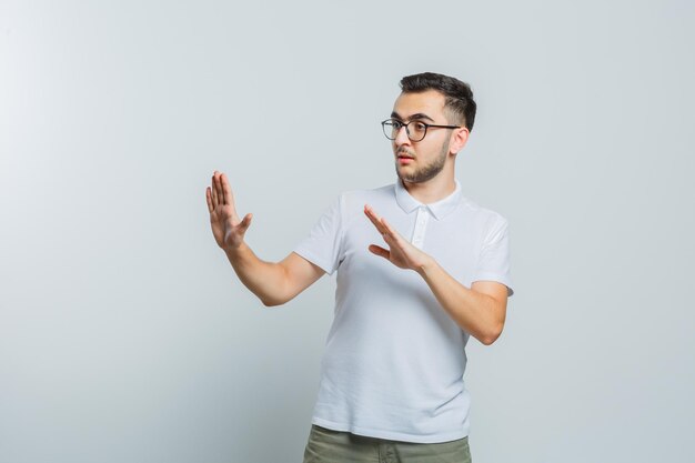 Expressive young guy posing in the studio