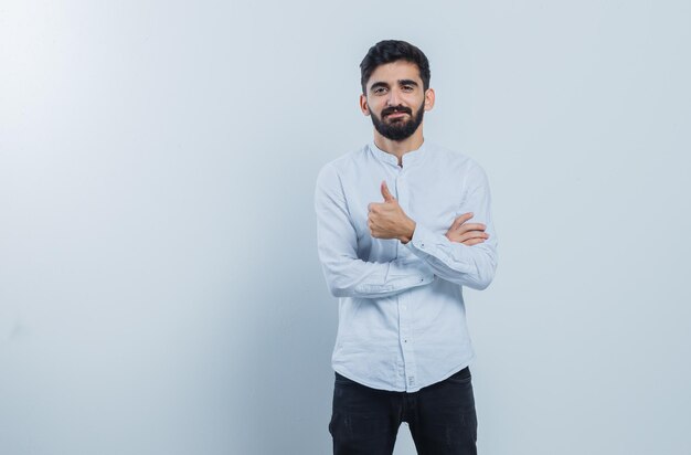 Expressive young guy posing in the studio