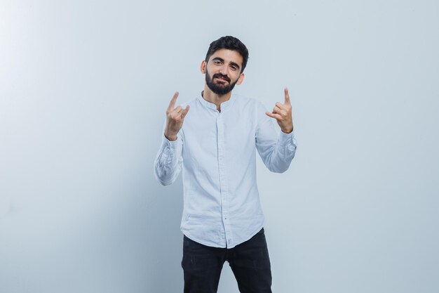 Expressive young guy posing in the studio