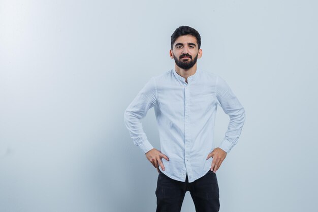 Expressive young guy posing in the studio