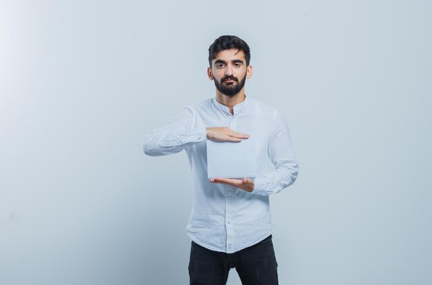 Expressive young guy posing in the studio