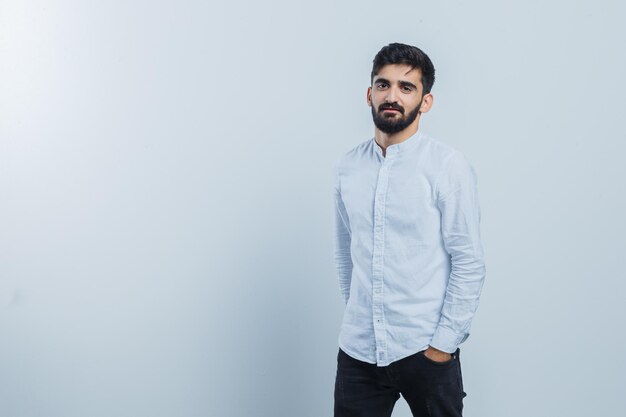 Expressive young guy posing in the studio