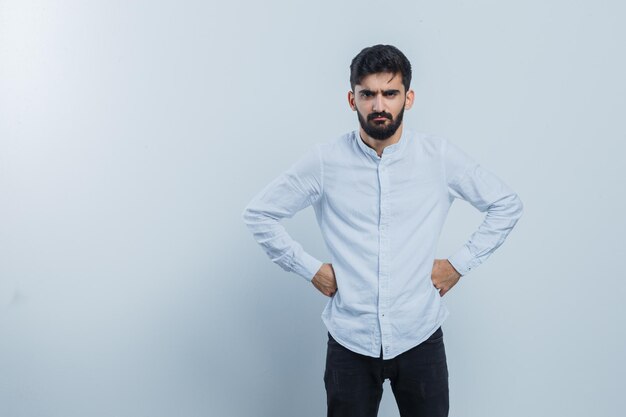 Expressive young guy posing in the studio