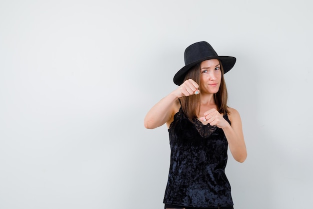 Expressive young lady posing in the studio