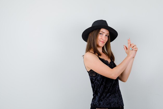 Expressive young lady posing in the studio