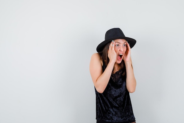 Expressive young lady posing in the studio