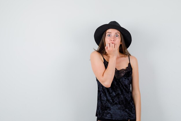 Expressive young lady posing in the studio