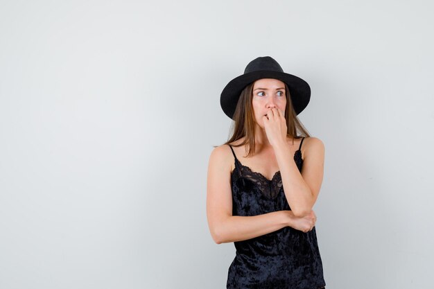 Expressive young lady posing in the studio