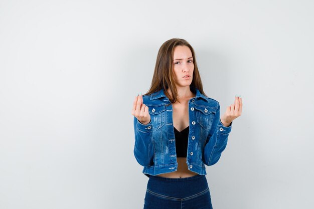 Expressive young lady posing in the studio