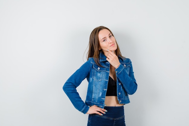 Expressive young lady posing in the studio