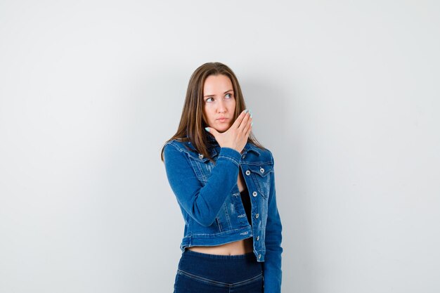 Expressive young lady posing in the studio