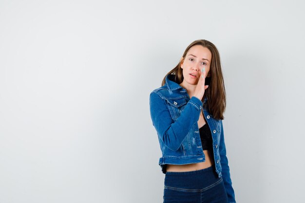 Expressive young lady posing in the studio