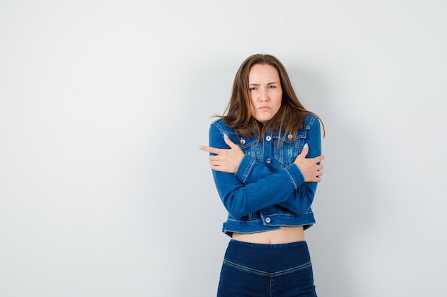 Expressive young lady posing in the studio