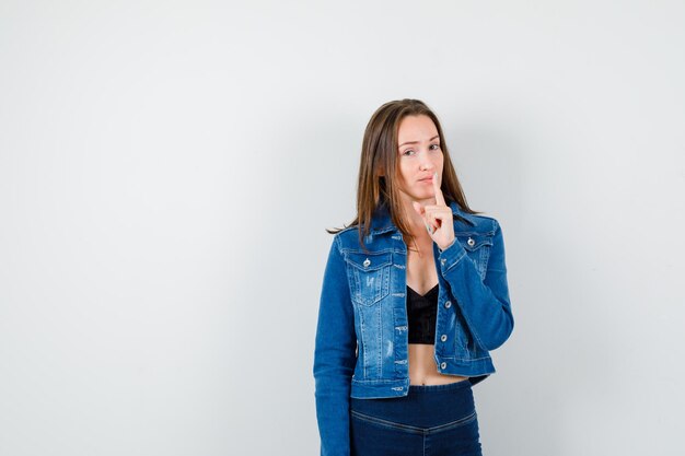 Expressive young lady posing in the studio