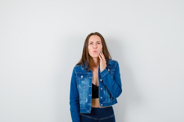 Expressive young lady posing in the studio