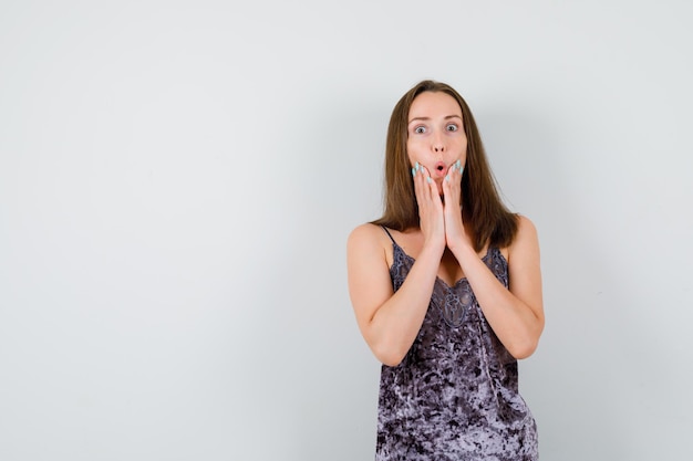 Expressive young lady posing in the studio