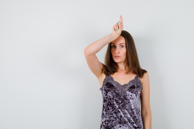 Expressive young lady posing in the studio