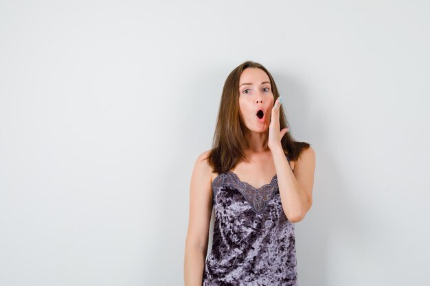 Expressive young lady posing in the studio