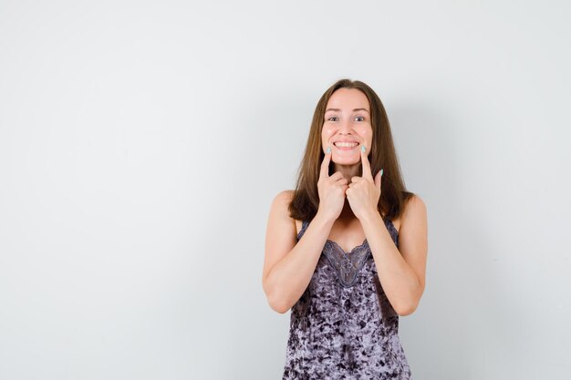 Expressive young lady posing in the studio