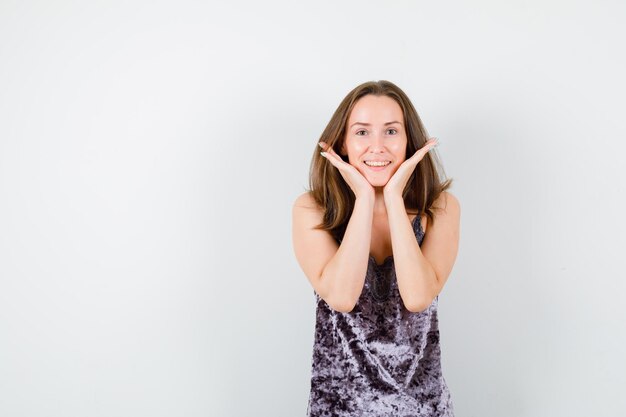 Expressive young lady posing in the studio