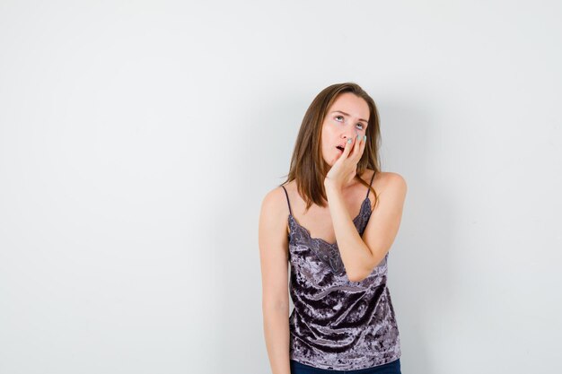 Expressive young lady posing in the studio