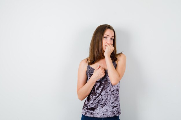 Expressive young lady posing in the studio