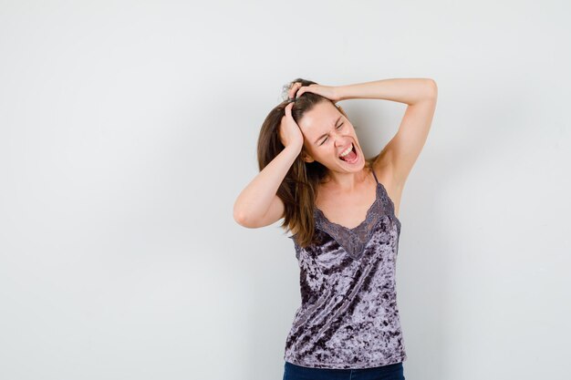 Expressive young lady posing in the studio