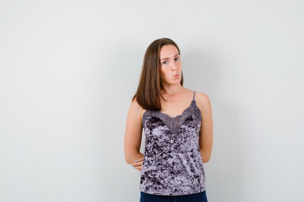 Expressive young lady posing in the studio