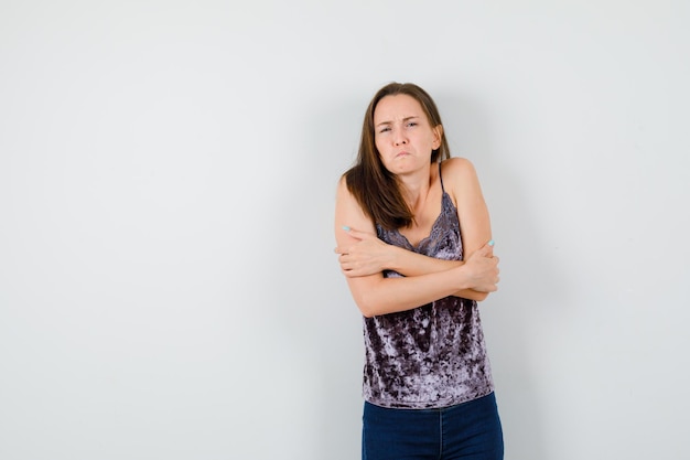 Expressive young lady posing in the studio