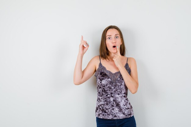 Expressive young lady posing in the studio