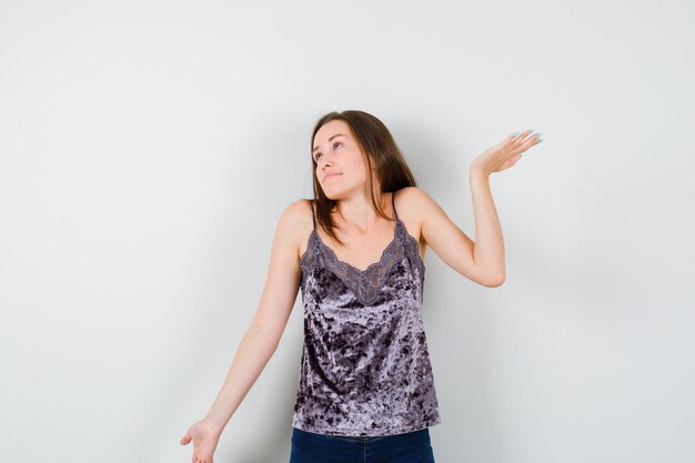 Expressive young lady posing in the studio