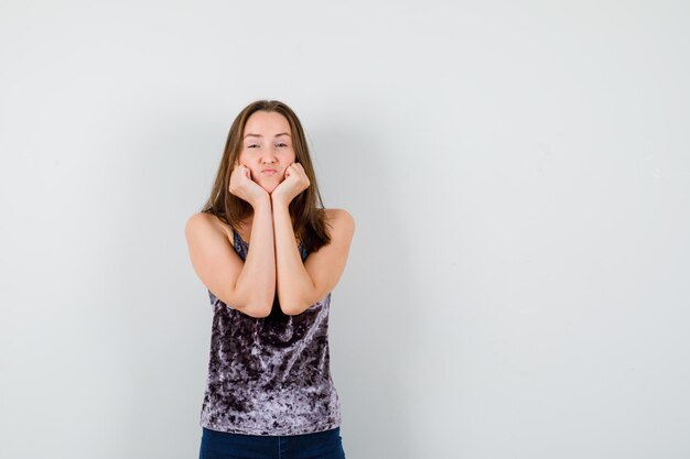 Expressive young lady posing in the studio