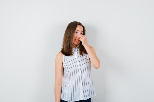 Expressive young lady posing in the studio