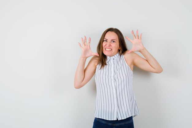 Expressive young lady posing in the studio